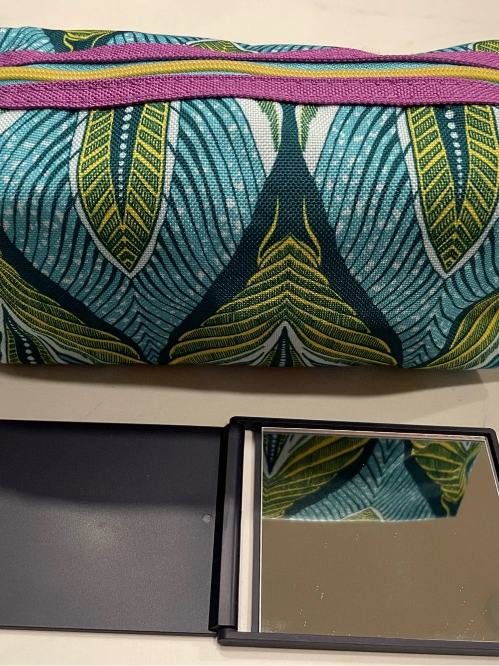 Estée Lauder Blue & Green Leaf-Print Cosmetic Pouch with matching pocket mirror.